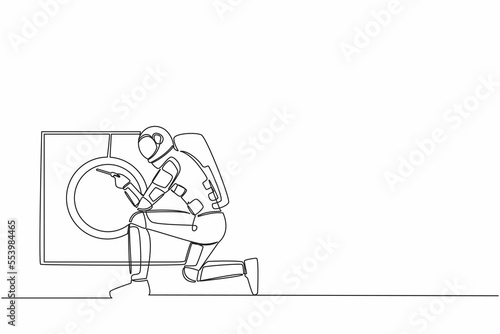 Single continuous line drawing of young astronaut fixing washing machine at home in moon surface. Future space technology development. Cosmonaut deep space. One line graphic design vector illustration