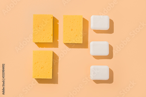 Geometric mockup layout square pattern sponge for washing and bar of soap. Beige background.
