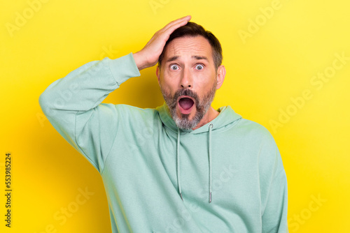 Εκτύπωση καμβά Photo of astonished speechless upset guy dressed mint sweatshirt hold palm on he