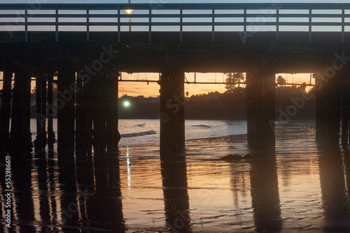 Wallpaper Mural The setting sun is being reflected in the water behind the Santa Cruz Wharf. Torontodigital.ca