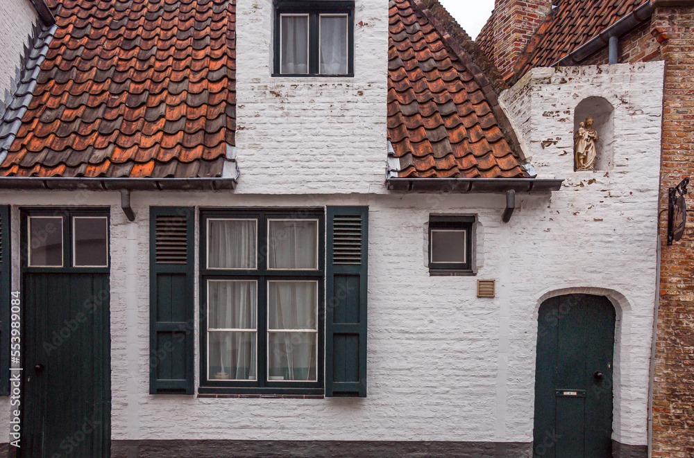 green shutters on old city house in Brugge