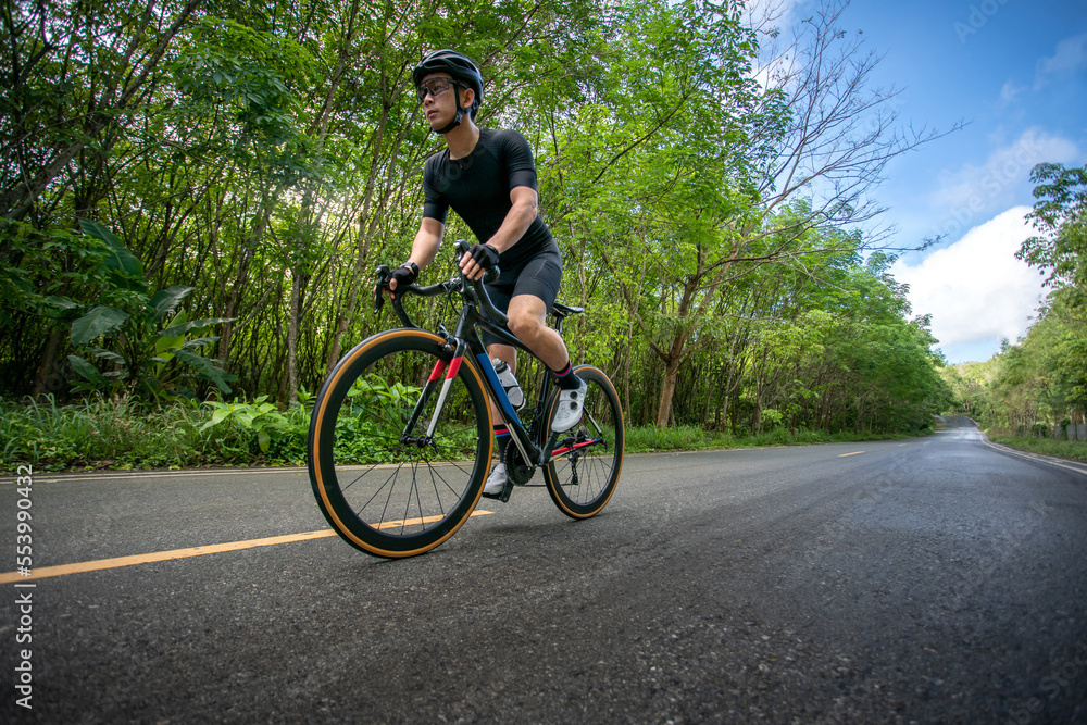 Obraz premium happy active cyclist ride professional bicycle bike for workout exercise and practice for race competition tour on beautiful outdoor nature road