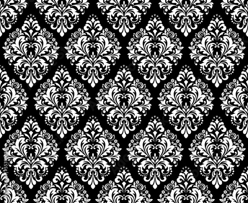 Wallpaper in the style of Baroque. Seamless vector background. White and black floral ornament. Graphic pattern for fabric, wallpaper, packaging. Ornate Damask flower ornament