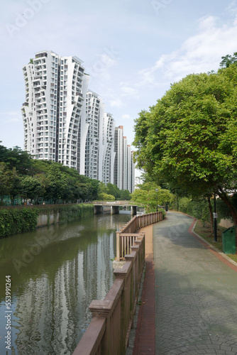 low angle view of signapore residential buildings against blue sky 