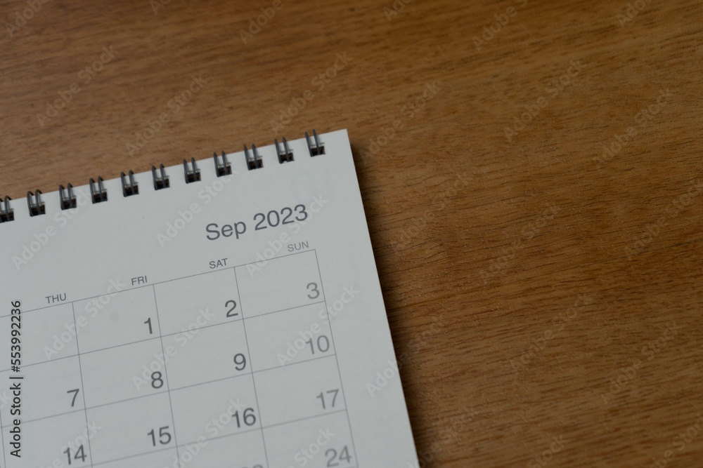 September 2023 calendar page on wood background. Calendar background for reminder, business planning, appointment meeting and event. September 2023 calendar page on wood background. Calendar background for reminder, business planning, appointment meeting and event.