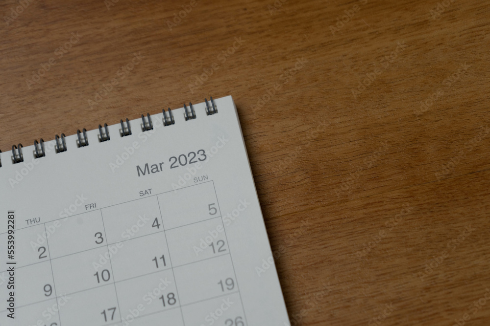 March 2023 calendar page on wood background. Calendar background for reminder, business planning, appointment meeting and event. March 2023 calendar page on wood background. Calendar background for reminder, business planning, appointment meeting and event.