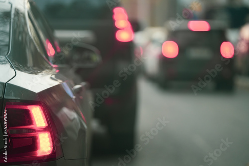 traffic. cars caught in the crowd. photo taken in the evening. people in traffic returning from work.