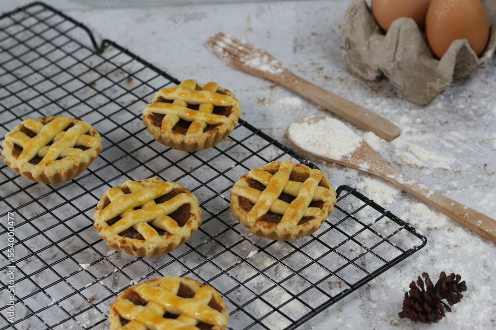 Small apple pie served on a cake rack, tastes sweet and savory. Food concept photo. Small apple pie served on a cake rack, tastes sweet and savory. Food concept photo.