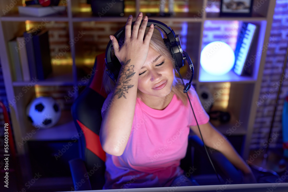 Young blonde woman streamer stressed using computer at gaming room Young blonde woman streamer stressed using computer at gaming room