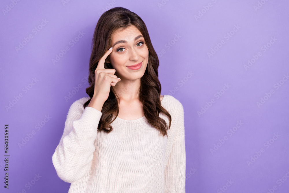 Photo of funky positive minded young woman stand empty space finger touch temple advise think more isolated on purple color background Photo of funky positive minded young woman stand empty space finger touch temple advise think more isolated on purple color background