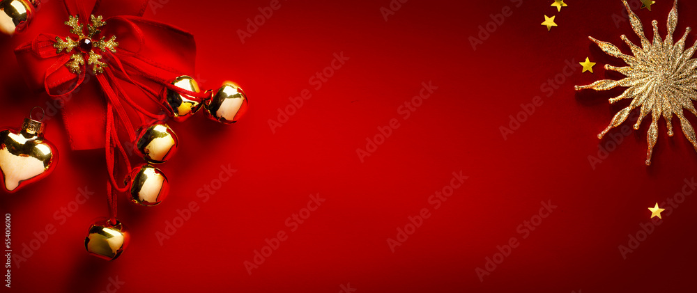 Christmas greeting card or holidays banner design; Golden Christmas tree decoration on red background; Copy space Christmas greeting card or holidays banner design; Golden Christmas tree decoration on red background; Copy space