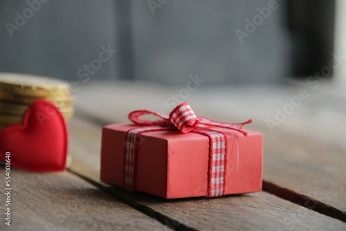 Gift on a wooden background. Christmas card.