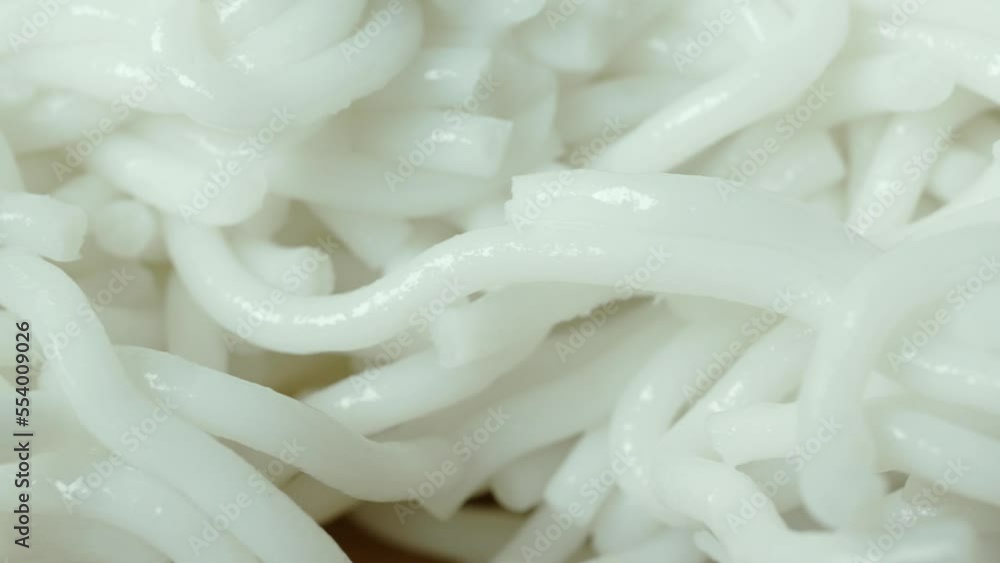 detail shot of white boiled noodles in a bowl detail shot of white boiled noodles in a bowl