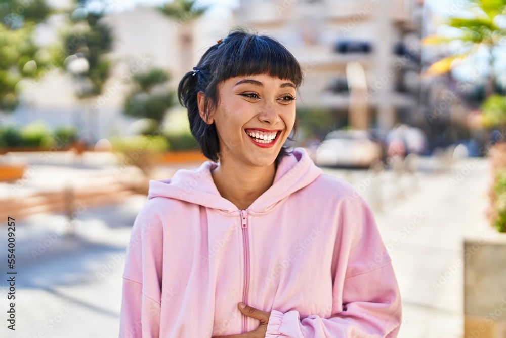 Young woman smiling confident standing at street Young woman smiling confident standing at street