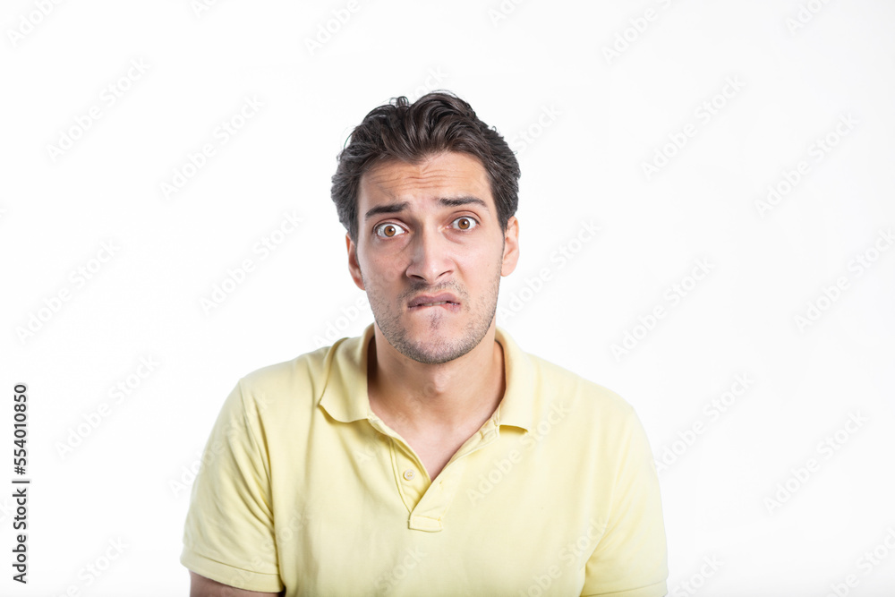 Close up portrait of depressed man sitting isolated on white background Close up portrait of depressed man sitting isolated on white background