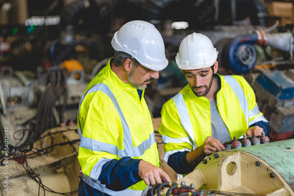 professional technician engineer with safety hard hat working to maintenance construction equipment in industrial factory, inspection man having manufacturing occupation job of production technology professional technician engineer with safety hard hat working to maintenance construction equipment in industrial factory, inspection man having manufacturing occupation job of production technology