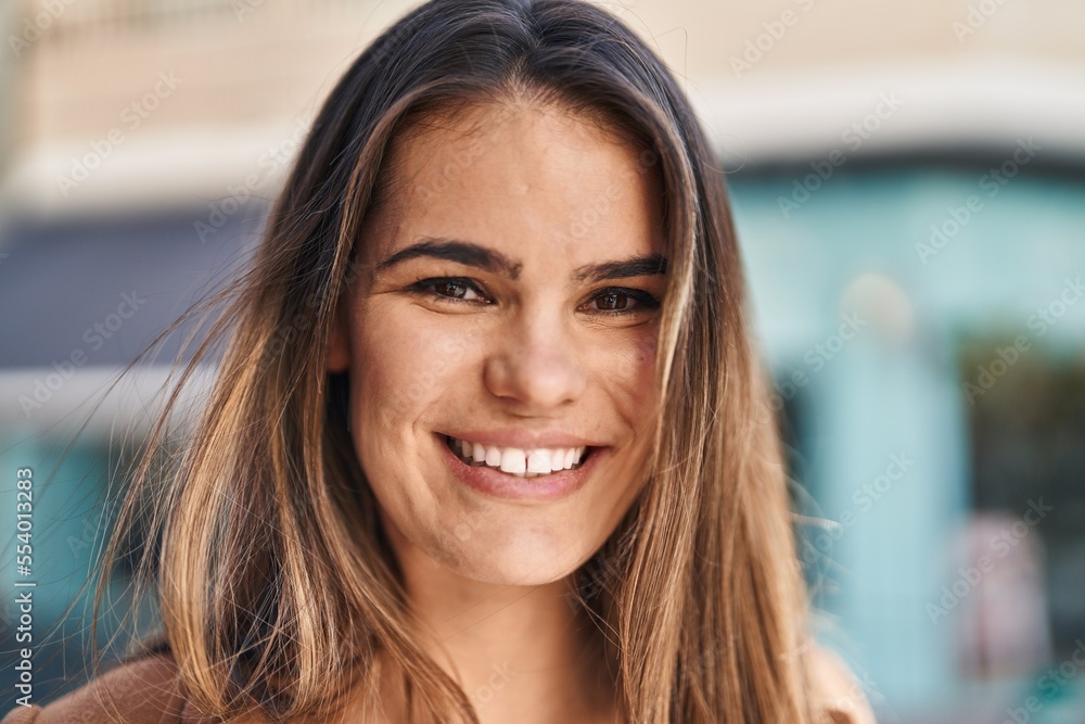 Young beautiful hispanic woman smiling confident standing at street Young beautiful hispanic woman smiling confident standing at street
