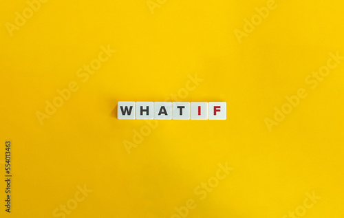 What If Question on Letter Tiles on Yellow Background. Minimal Aesthetics.