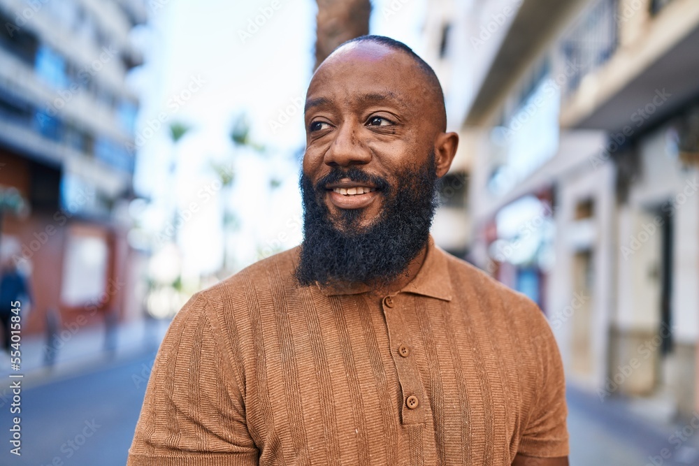 Young african american man smiling confident standing at street Young african american man smiling confident standing at street