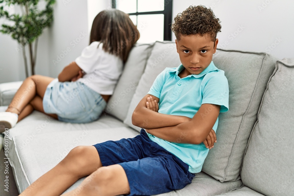 Brother and sister angry having problem sitting on sofa at home Brother and sister angry having problem sitting on sofa at home