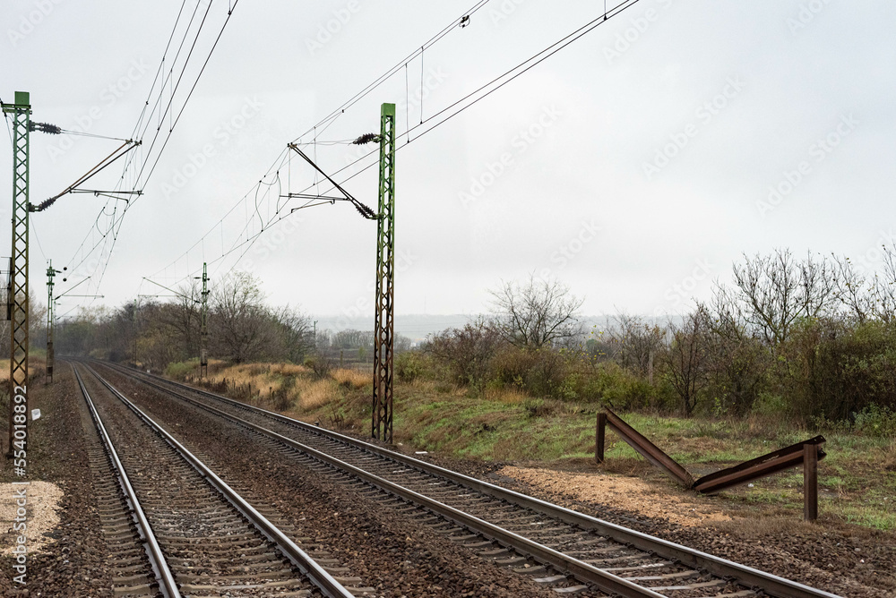 Railway tracks in dark moody autumn weather