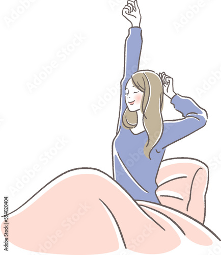 ベッドで伸びをする女性