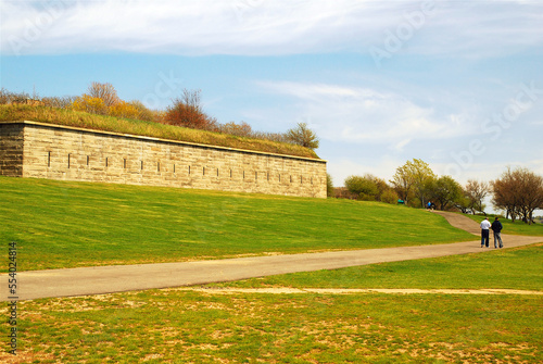 The stone walls of Fort Warren on Georges Island dwarf the people along side in the Boston Harbor Islands National Recreation Area