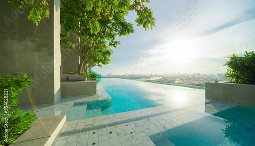 Swimming pool on rooftop of hotel apartment building in Bangkok downtown skyline, urban city view. Relaxing in summer season in travel holiday vacation concept. Recreation lifestyle. © tampatra