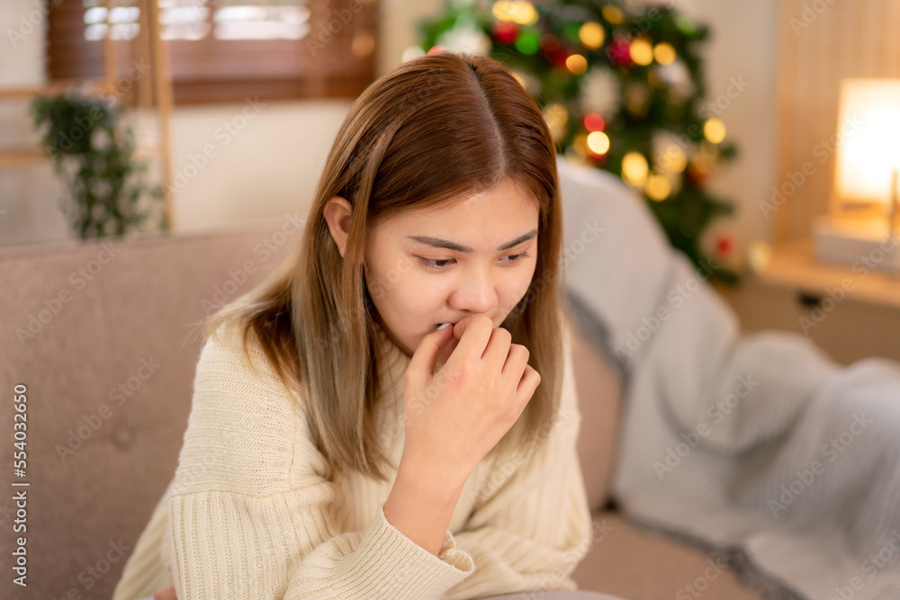 Young asian woman wearing sweater and touching mouth with hand while feeling sad and disappointed in holiday Young asian woman wearing sweater and touching mouth with hand while feeling sad and disappointed in holiday