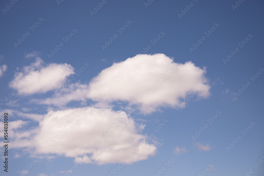 Obraz premium White clouds in the blue sky.