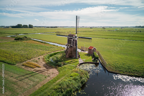 Dutch Mill between the field in the Netherlands