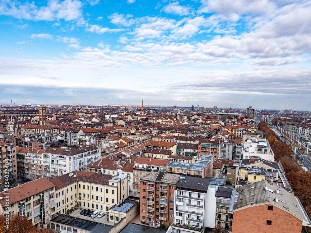 Skyline of Turin, Italy, in winter. The mountain in back and the Mole Antonelliana, Piazza Castello, Porta Susa Station, Turin court and the city centre. The city in winter with a blue sky