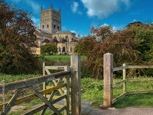 Autumn colours come to Tewkesbury Abbey on a beautiful October afternoon, Gloucestershire, UK. A mobile phone photo with some phone or tablet post processing.