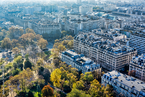 Panoramic aerial view of Paris from Eiffel Tower. Beautiful view of Paris skyline with typical parisian facades in the center.