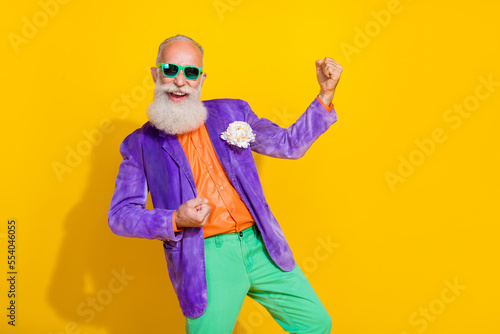 Photo of aged man triumphant raise fist up win millionaire lottery isolated on shine color background