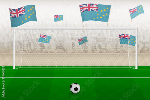 Tuvalu football team fans with flags of Tuvalu cheering on stadium, penalty kick concept in a soccer match.
