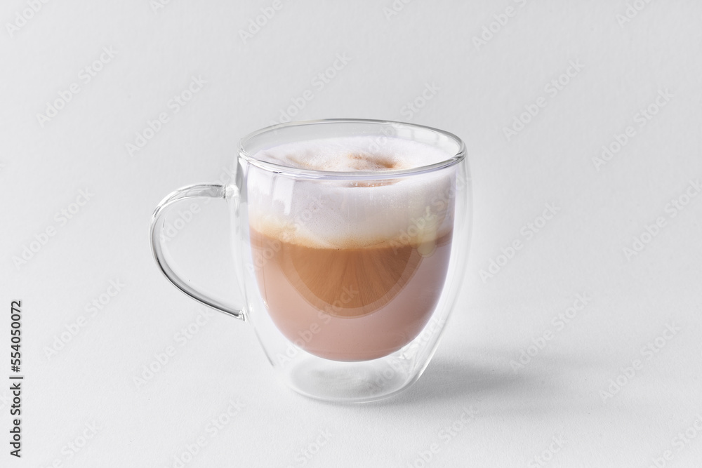 One cup of cappuccino coffee over white isolated background One cup of cappuccino coffee over white isolated background