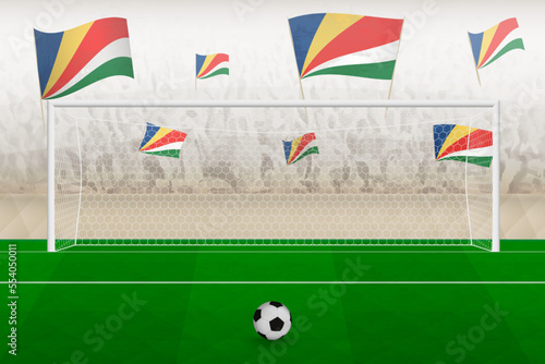 Seychelles football team fans with flags of Seychelles cheering on stadium, penalty kick concept in a soccer match.