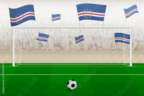 Cape Verde football team fans with flags of Cape Verde cheering on stadium, penalty kick concept in a soccer match.