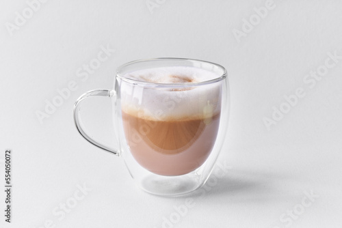  One cup of cappuccino coffee over white isolated background