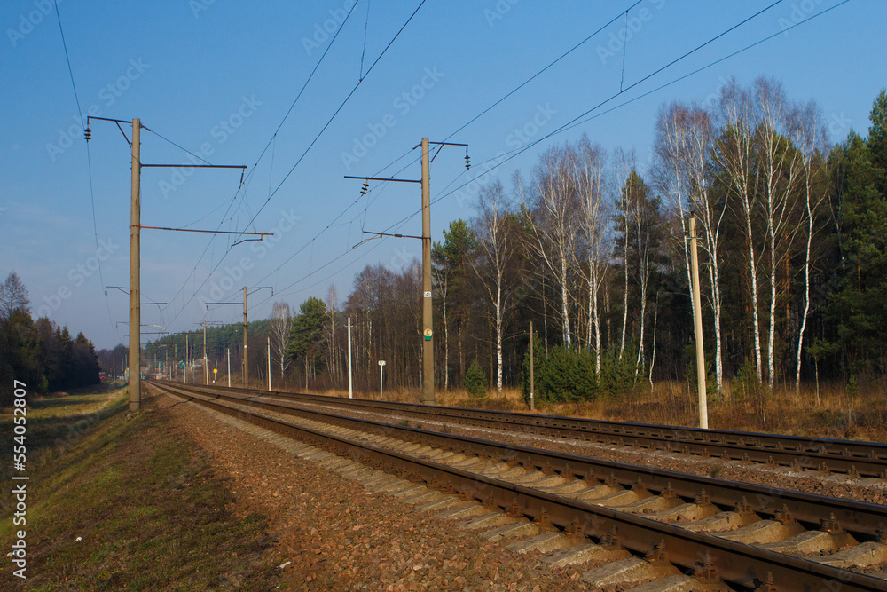 Railway tracks on a summer day and a view of the station Railway tracks on a summer day and a view of the station