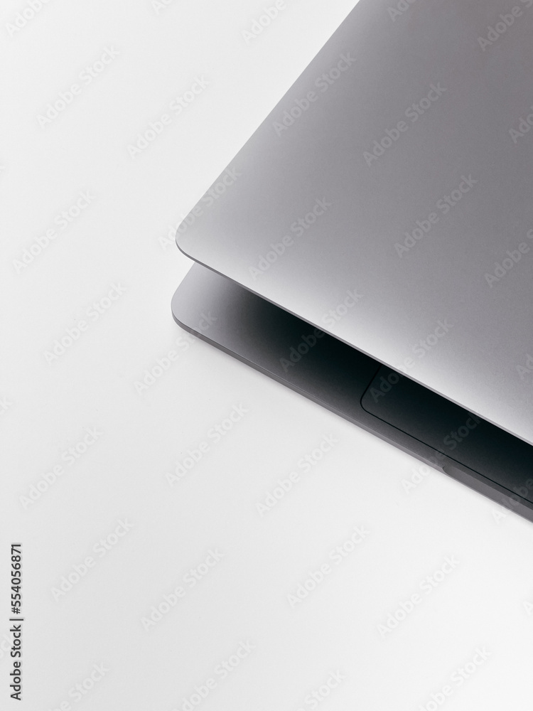 MacBook Pro top view. Grey laptop, personal computer on a white background. Office gadget, pc, notebook. MacBook Pro top view. Grey laptop, personal computer on a white background. Office gadget, pc, notebook.