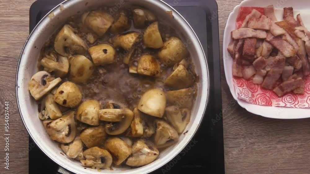 Pieces of fried mushrooms in a creamy sauce Pieces of fried mushrooms in a creamy sauce