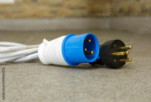Electric plug with wires for connecting the generator. Special electrical plugs for the output of the received electricity. Detailing.
