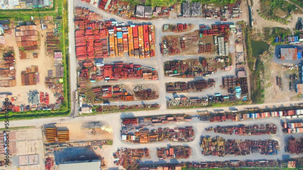Drone flying over a steel and concrete material on outside storage yard. steel and concrete is a important construction material used to build infrastructure. logistics and transportation concept
Drone flying over a steel and concrete material on outside storage yard. steel and concrete is a important construction material used to build infrastructure. logistics and transportation concept