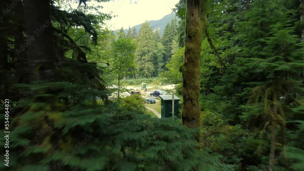 Fly from the campsite entrance to the deep green forest in Canada Fly from the campsite entrance to the deep green forest in Canada