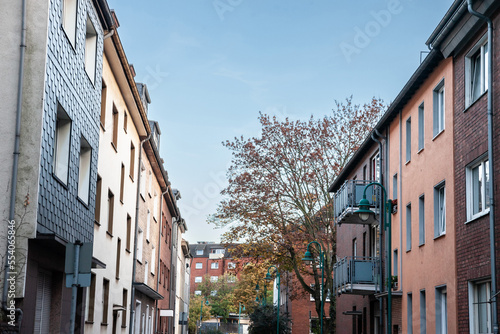 Typical residetial street with multistorey residential buildings in a suburban street of Duisburg, germany, in a Western Europea background. ..