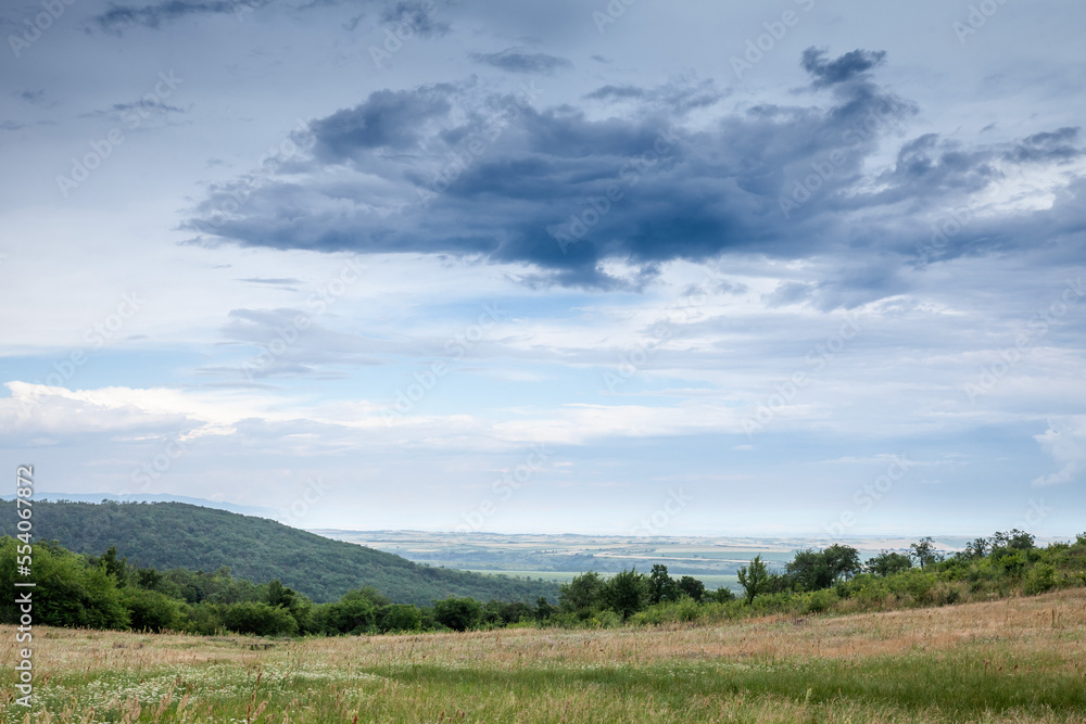 Aerial panorama of plains of Vojvodina, in Serbia, during a cloudy afternoon, seen from the Vrsacki Breg, or Vrsac hill, a major landmark in Eastern Serbia. ...