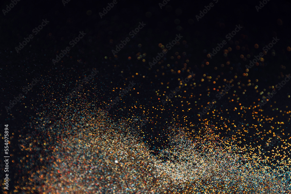 Fototapeta premium Abstract background of blurred colourful glitter for design. Lights bokeh dis focus. Christmas background, copy space