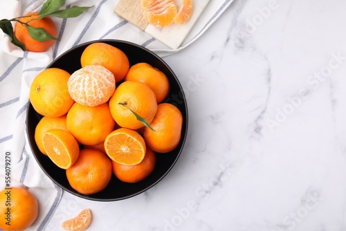 Fresh juicy tangerines on white marble table, flat lay. Space for text © New Africa